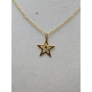 Vintage necklace gold-tone chain and star w/ a yellow tone rhinestone